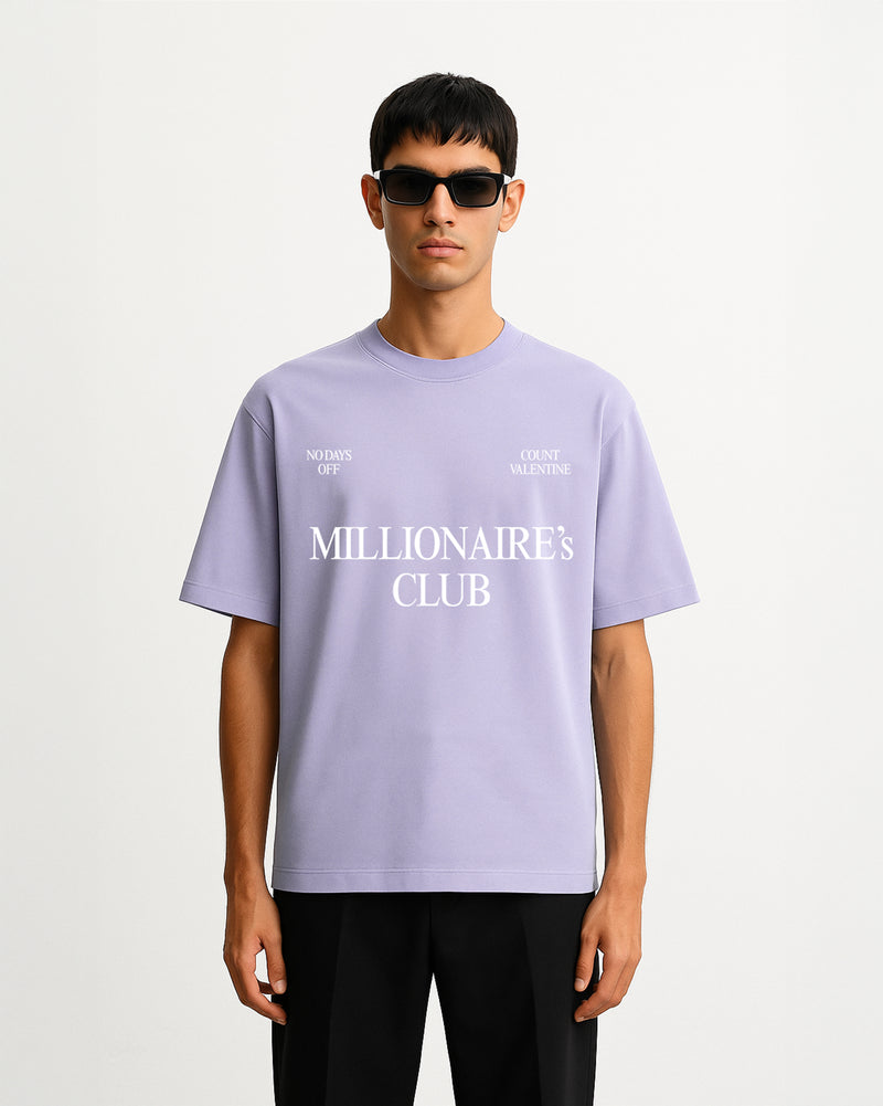 Person wearing a light purple t-shirt with text on a white background