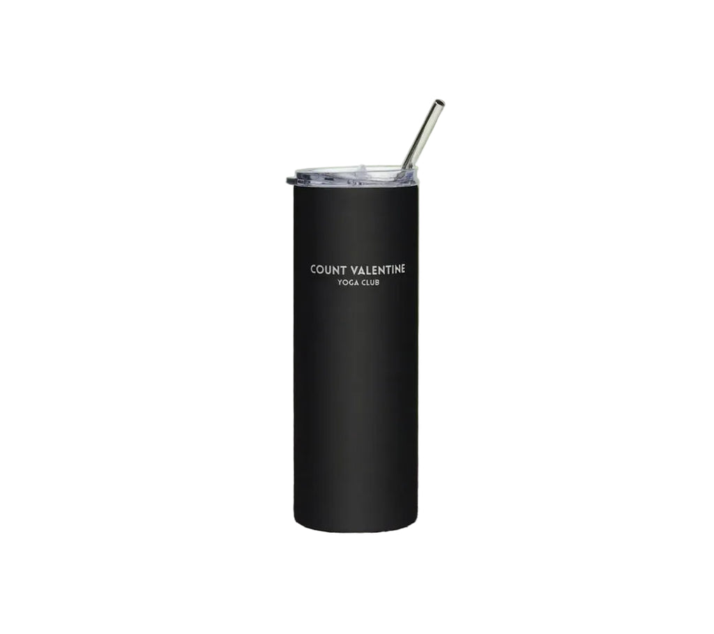 Black tumbler with a straw on a white background