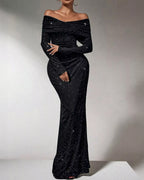 Black off-shoulder sequin gown on a plain background